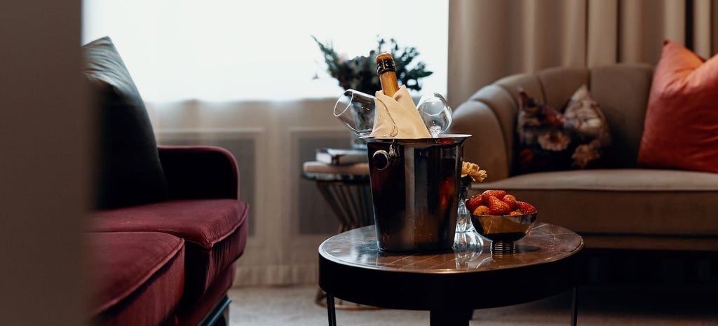 Elegant Swedish hotel room with sophisticated decor, plush bedding, soft neutral tones, and refined architectural details showcasing luxurious deluxe accommodation