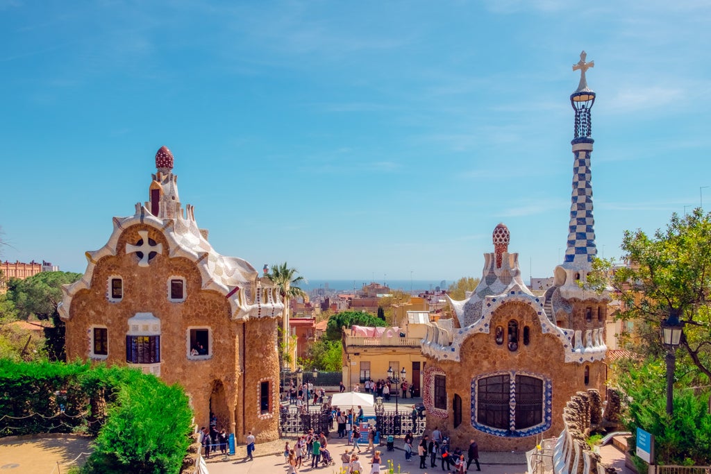 Luxurious Barcelona cityscape featuring intricate Gaudi architecture, with vibrant mosaic details of Sagrada Familia and colorful modernist building facades.