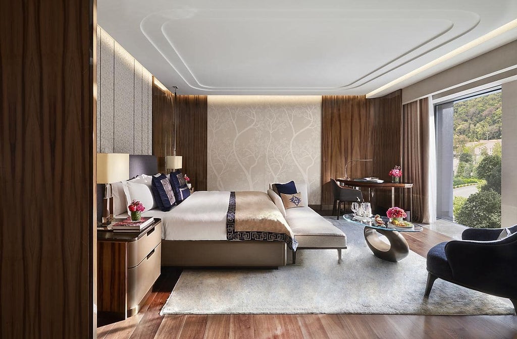 Elegant Mandarin Oriental superior room with plush king bed, expansive Bosphorus view, contemporary Turkish design, and soft neutral color palette