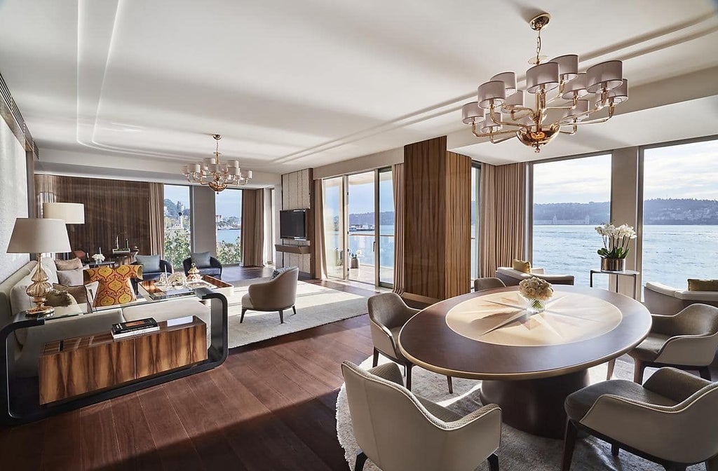 Luxurious junior suite at Mandarin Oriental Bosphorus with panoramic water views, elegant king bed, and contemporary Turkish-inspired design