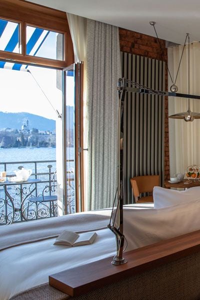 Luxurious prestige balcony room at La Réserve Eden au Lac Zurich, showcasing elegant Swiss design with lake view and sophisticated interior decor