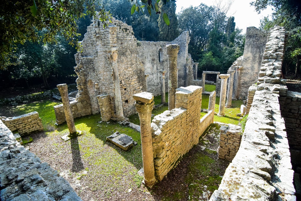 Cyclists explore scenic trails through ancient Roman ruins and Mediterranean forest on Croatia's exclusive Brijuni Islands resort