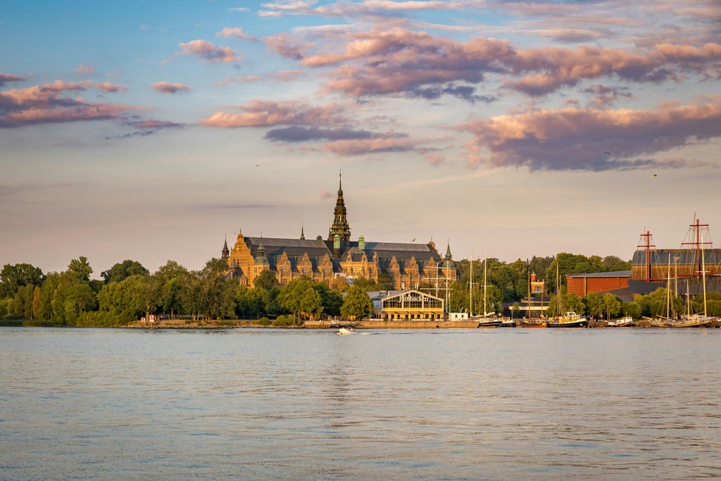 Luxurious private boat gliding through serene Stockholm Archipelago, with pristine waters, lush green islands, and elegant maritime scenery at sunset