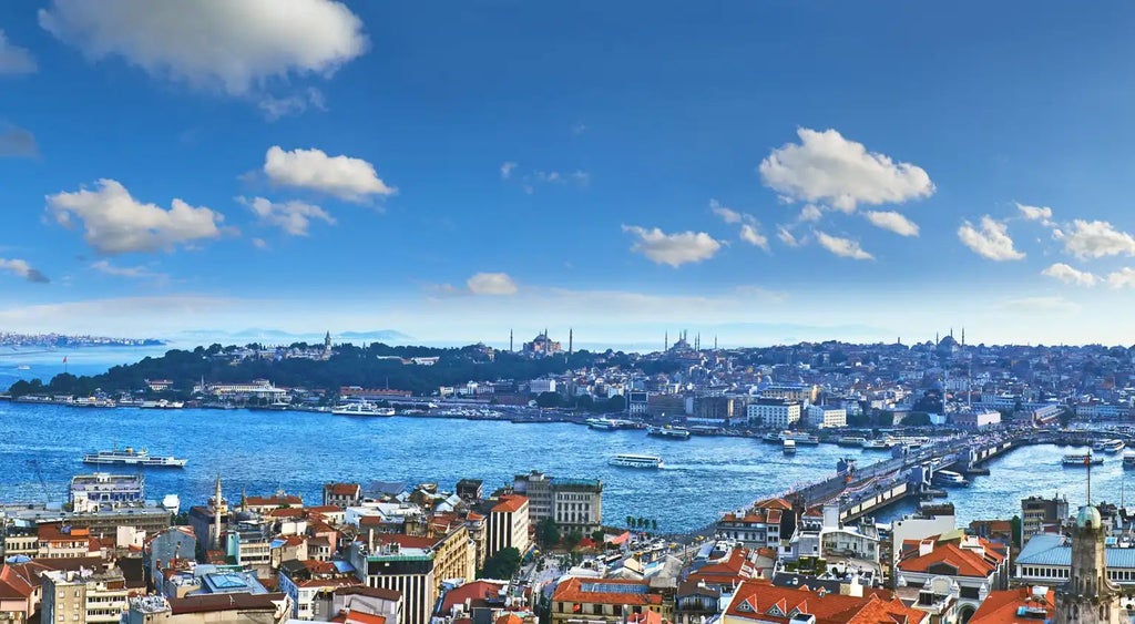 Elegant neoclassical building with grand facade, luxurious hotel entrance featuring marble columns and historic architectural details in Istanbul's historic district