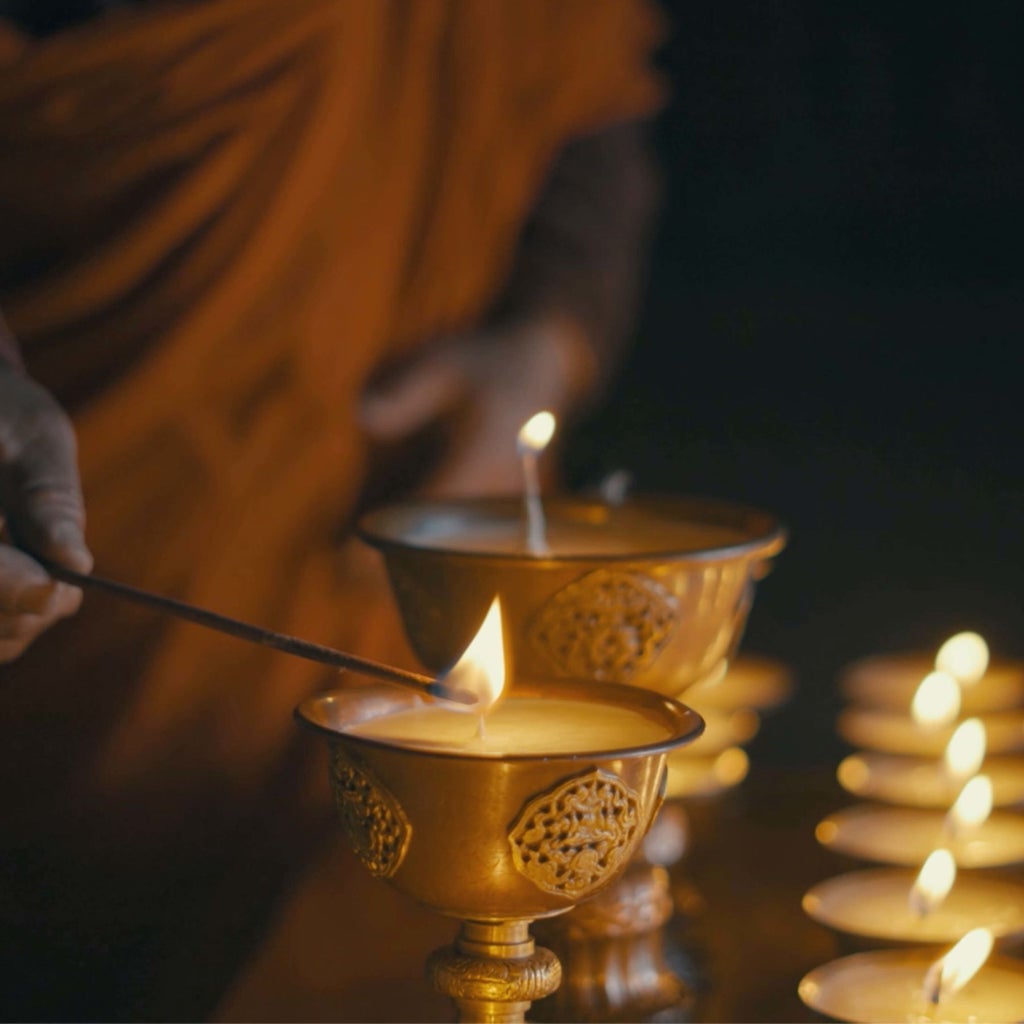 Luxurious COMO Uma Punakha hotel nestled in Bhutan's lush valley, showcasing traditional Bhutanese architecture with sweeping mountain landscape backdrop