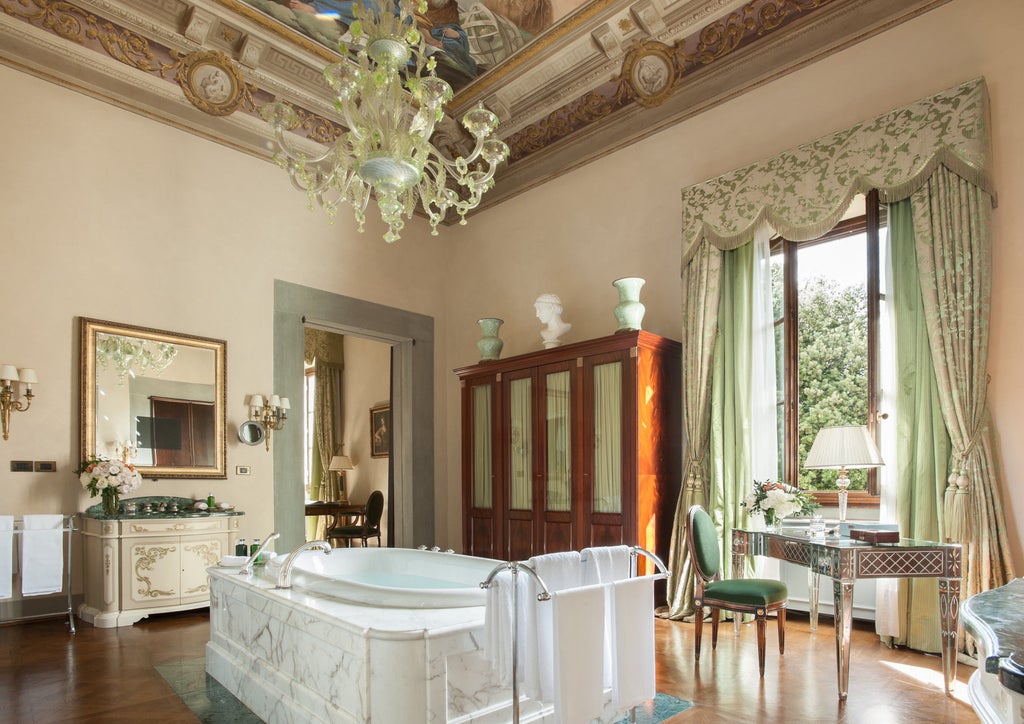 Ornate Renaissance-era palazzo with manicured Italian gardens, marble fountains and grand archways at the Four Seasons Florence