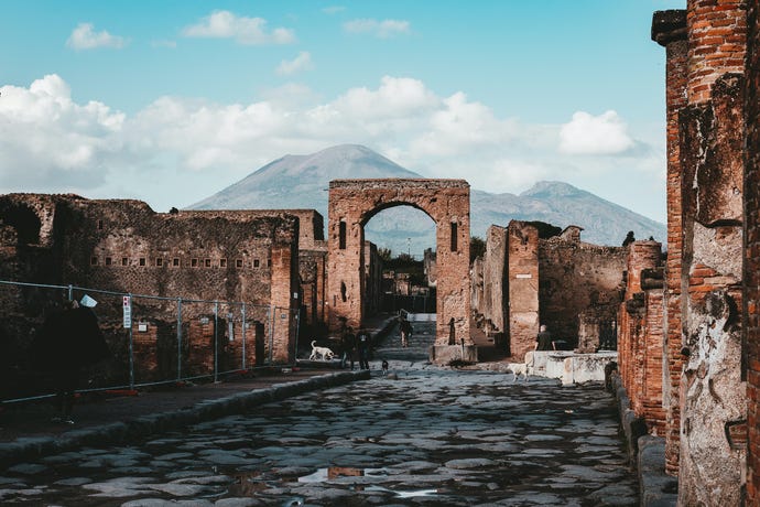 The ruins of Pompeii set against the backdrop of Mt. Vesuvius
