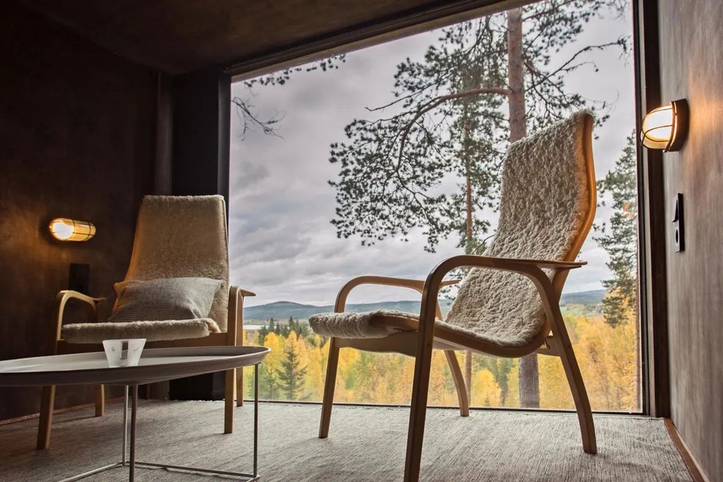 Sleek, modern dragonfly-shaped wooden hotel room suspended among pine trees in Swedish forest, reflecting mirrored exterior against lush green landscape