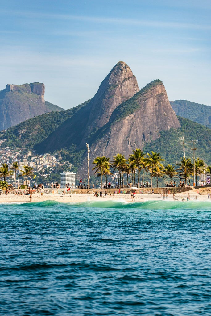 Luxury hotel overlooking Ipanema Beach, with sleek Art Deco design, panoramic ocean views, and elegant rooftop pool against Rio's iconic landscape