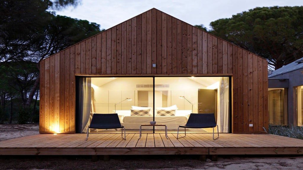 Minimalist luxury suite with bio pool, wooden deck, and panoramic view of natural landscape at Sublime Comporta Hotel & SPA in Portugal's serene countryside