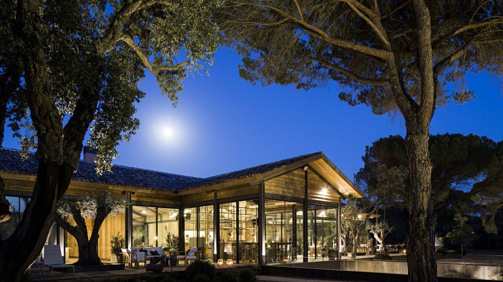 Minimalist luxury resort nestled in Portuguese coastal landscape, featuring sleek white architecture, natural wood accents, and serene infinity pool overlooking sandy terrain