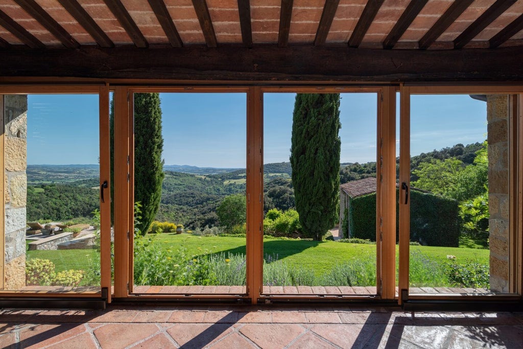 Rustic-luxe Tuscan suite with stone walls, elegant wooden furniture, and soft linens overlooking rolling Italian countryside vineyards at sunset