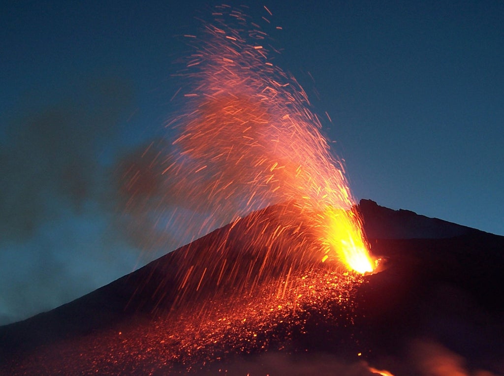 4x4 luxury jeep navigating rugged volcanic terrain on Mount Etna, with snow-capped peaks and black lava rocks in the backdrop