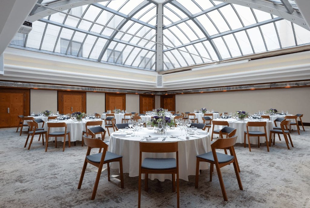 Elegant art deco hotel lobby with marble floors, brass accents, and sophisticated lighting in historic Prague, showcasing timeless luxury and refined architectural design