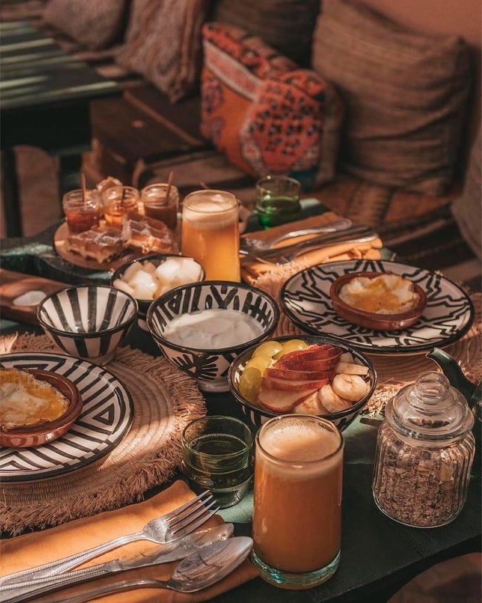 Breakfast and morning sunlight: freshly squeezed juice, fruits, eggs and Moroccan honey and toast