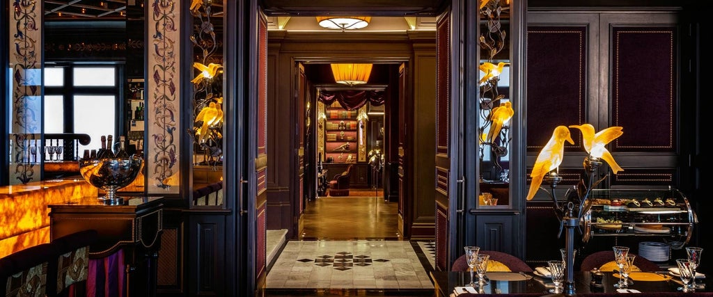 Opulent Art Deco hotel facade in central London, featuring ornate architectural details, lavish baroque-inspired design with rich burgundy and gold accents.