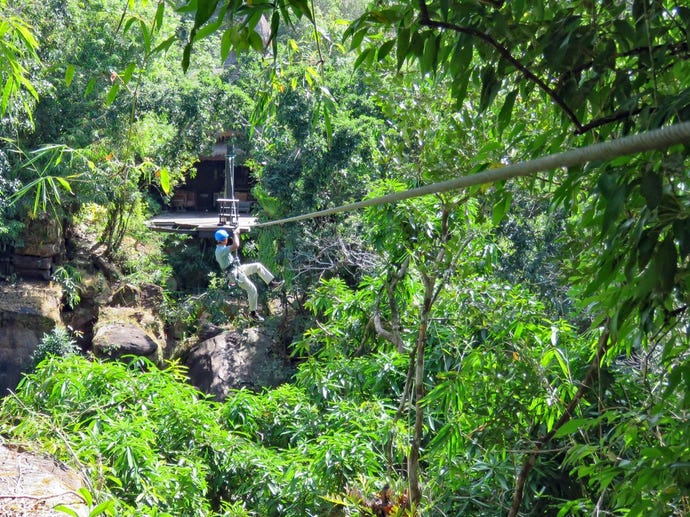 Zip-line over the falls as you arrive