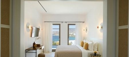 Luxurious one-bedroom villa in Mykonos with panoramic sea view, private heated pool, and elegant contemporary design blending with Aegean landscape