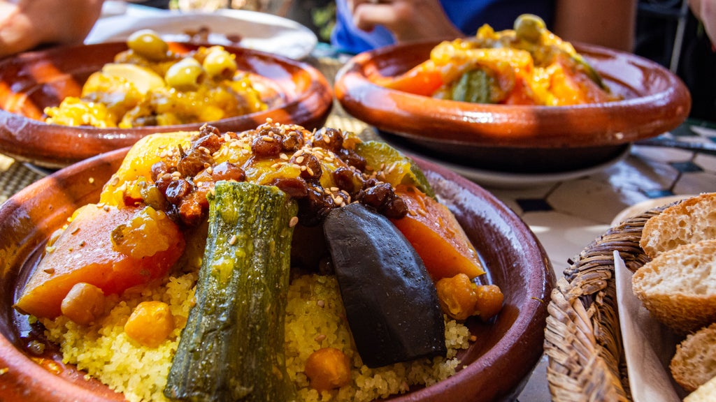 Traditional Moroccan spice market in Fez, vibrant stalls with colorful saffron, cumin, and paprika heaped in ornate ceramic bowls