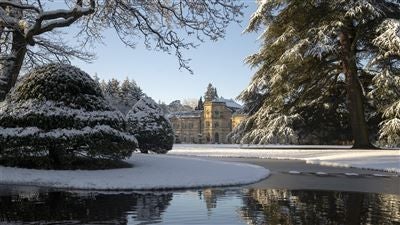 Luxurious Grantley Hall, a grand historic hotel nestled in lush Yorkshire countryside, featuring elegant stone architecture and manicured gardens