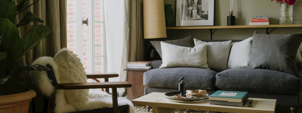 Elegant light-filled twin bedroom at Heckfield Place with soft neutral tones, plush bedding, and refined rustic-modern countryside design aesthetic