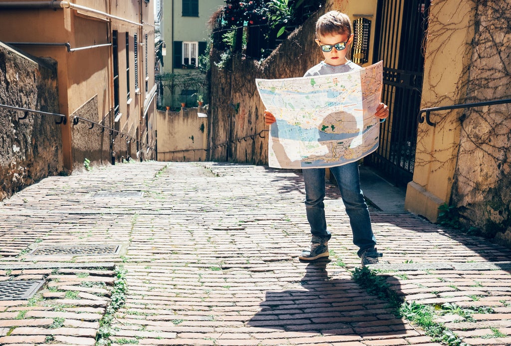 Ancient map of Rome with luxury clues overlaid, leading past iconic landmarks like Colosseum and Trevi Fountain on white parchment paper