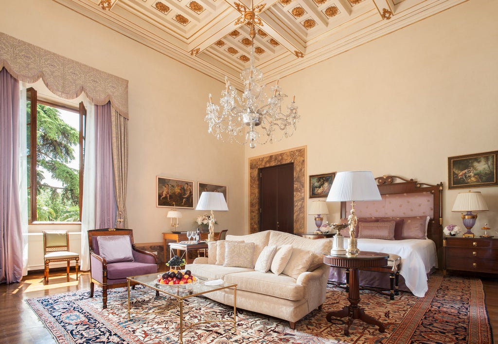 Opulent Renaissance-era Italian palace with manicured gardens, ornate stone facade and symmetrical arches in golden afternoon light