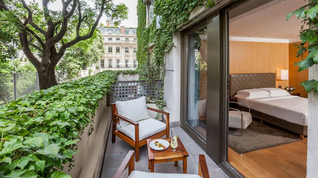 Elegant hotel room with crystal chandelier, king bed, French doors to private balcony, and luxurious cream furnishings at Park Hyatt Buenos Aires