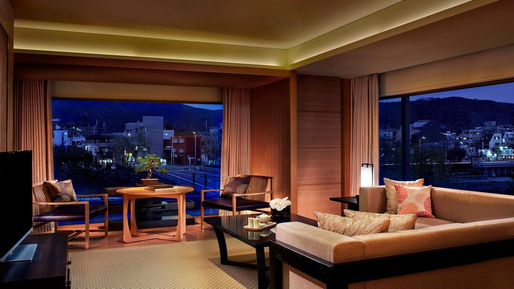 Luxurious scenset hotel with traditional Japanese architecture overlooking Kamo River, featuring elegant interiors, modern design, and scenic Kyoto cityscape backdrop