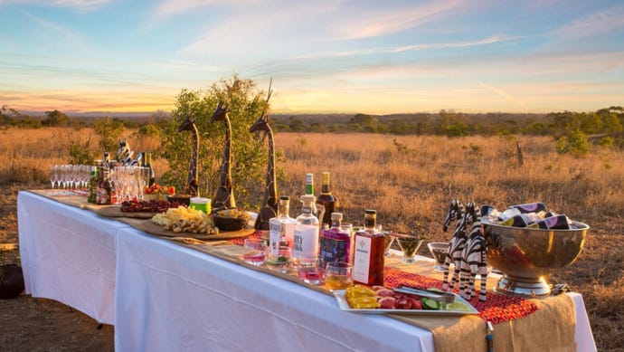 End your drives with sundowner drinks out in the safari plains of the Timbavati
