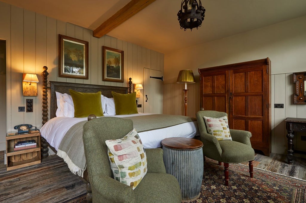 Rustic-chic hotel room with plush white bed, exposed wooden beams, and elegant countryside views of the South Downs landscape in soft natural light