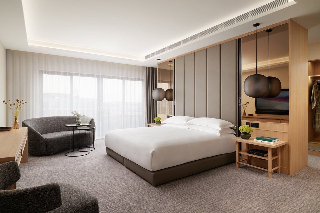 Luxurious Nobu Penthouse suite with contemporary design, expansive city views, minimalist furnishings, and elegant neutral color palette in London's Portman Square