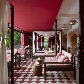 Luxurious colonial-era hotel nestled in Santa Teresa neighborhood, Rio de Janeiro, with elegant architecture, tropical gardens, and vibrant Brazilian charm