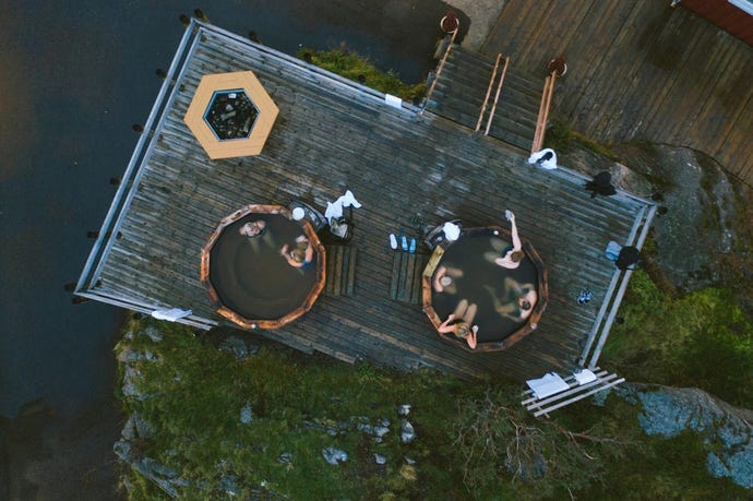 Chill under the stars in the outdoor hot tubs, or brave the icy fjord after a morning sauna