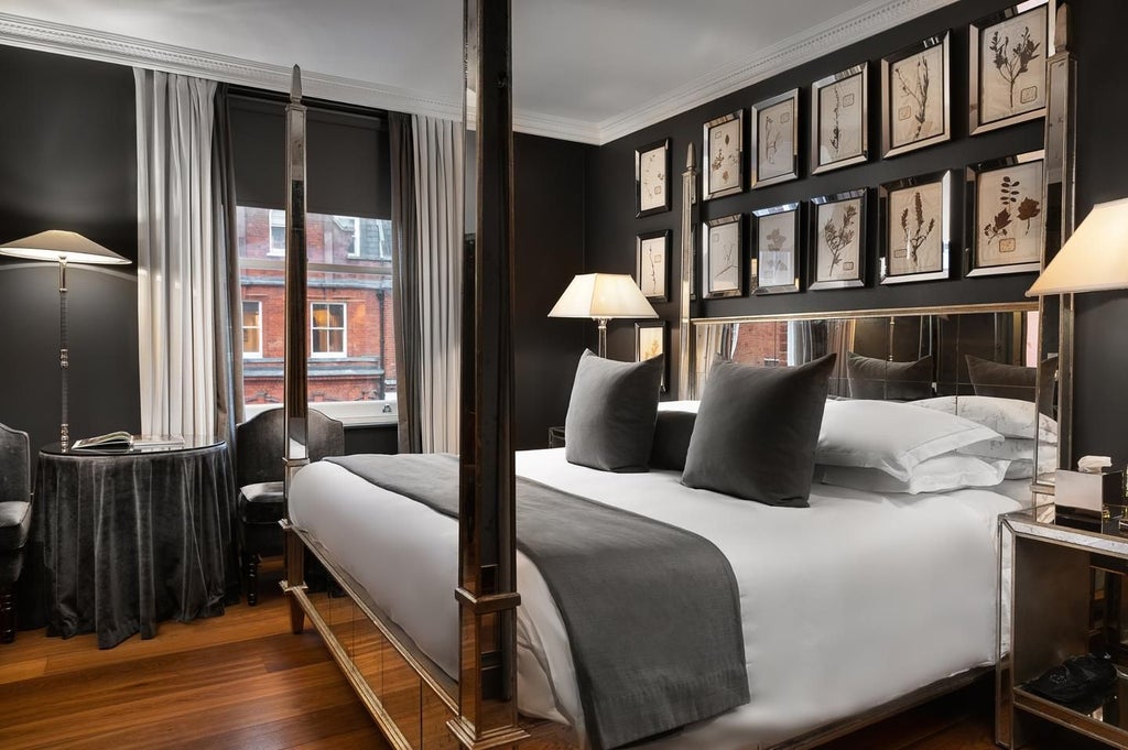 Elegant superior hotel room at The Franklin, featuring luxurious contemporary design with neutral tones, plush bedding, and sophisticated minimalist decor in the United Kingdom.