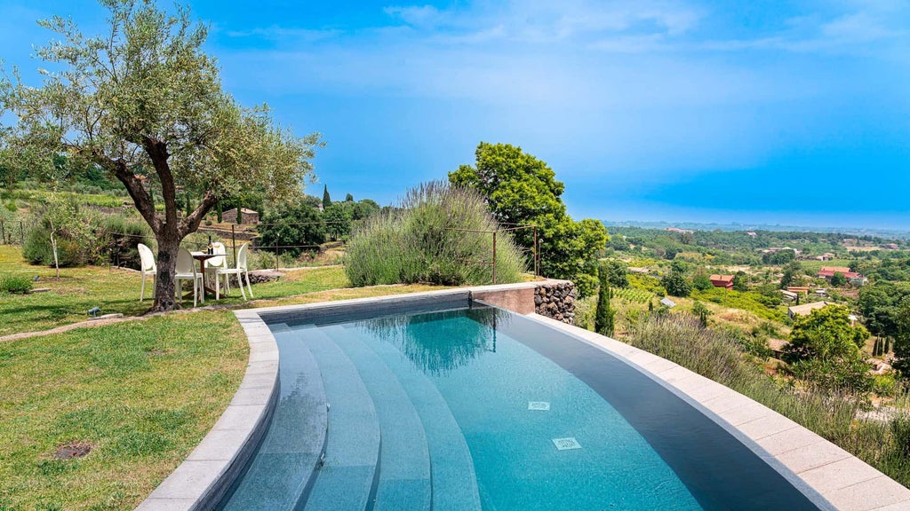 Luxurious two-bedroom pool villa at Monaci delle Terre Nere, Sicily, featuring elegant decor, panoramic volcanic landscape, and modern Mediterranean design.