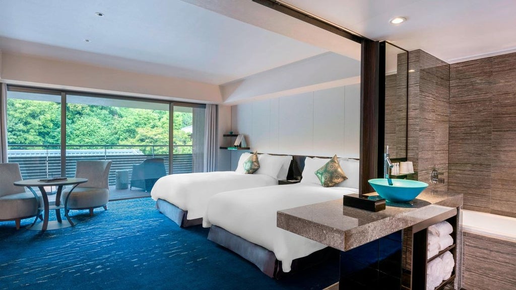 Elegant Suiran Presidential Suite in Kyoto, featuring traditional Japanese design with modern luxuries, plush bedding, and panoramic views of serene landscape