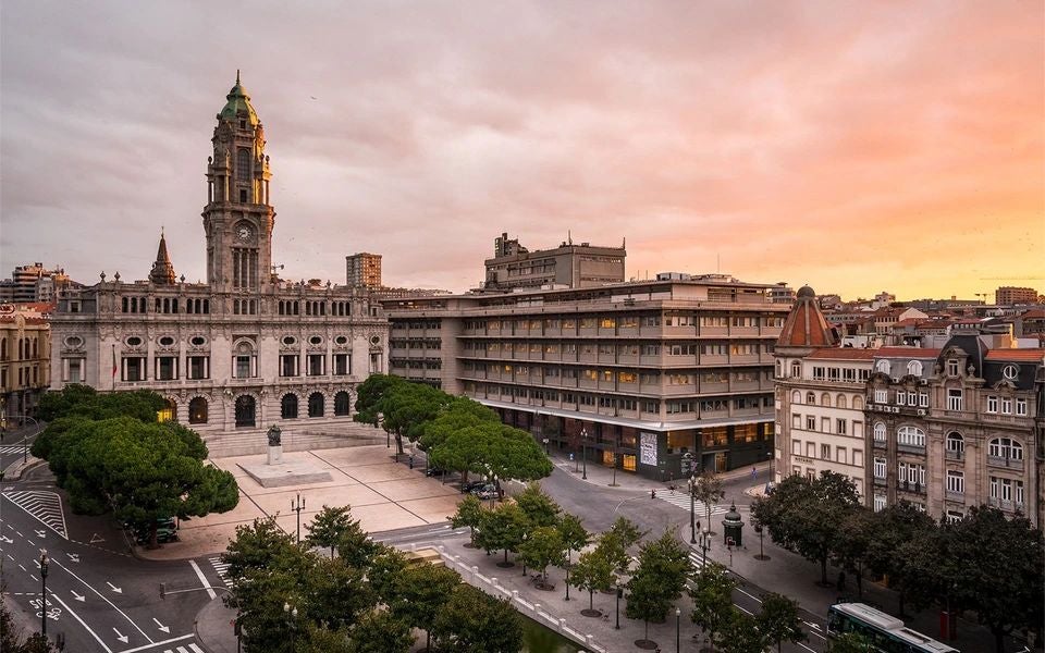 Elegant Art Deco facade of Maison Albar Hotels Le Monumental Palace in Porto, featuring grand windows, ornate architectural details, and timeless luxury charm.