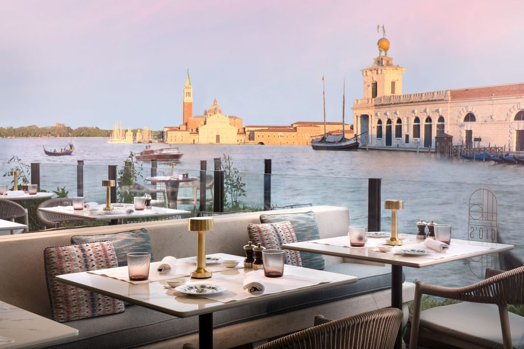 Opulent St. Regis Venice hotel with ornate Grand Canal facade, private dock, striped mooring poles, and traditional Venetian architecture