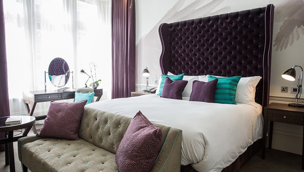 Luxurious single and double room at the Scenset Hotel, featuring elegant decor, crisp white linens, and contemporary furnishings in a sophisticated UK setting.