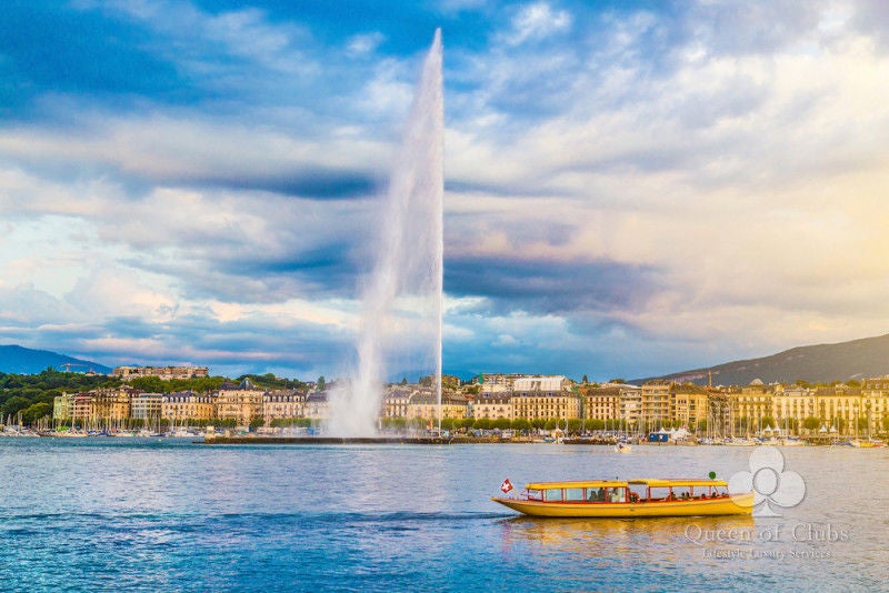 Crystal-clear Lake Geneva with Mont Blanc peaks in background, surrounded by pristine parks and luxurious waterfront hotels