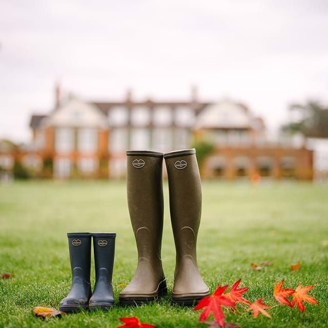 Luxurious countryside retreat showcasing elegant spa hotel nestled in lush green landscape with modern architectural design and pristine gardens.