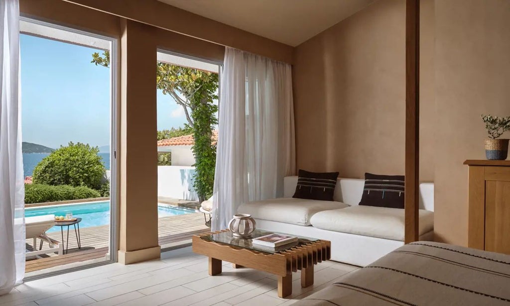 Luxurious two-bedroom bungalow with private pool overlooking azure Aegean Sea, featuring elegant Mediterranean design and stunning coastal landscape