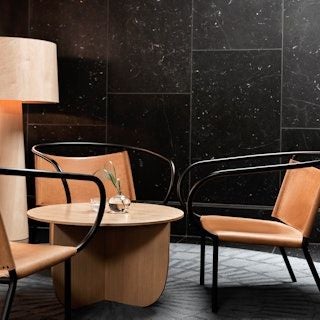 Elegant lobby of scenic hotel in Copenhagen with modern Nordic design, contemporary furniture, soft lighting, and luxurious marble accents