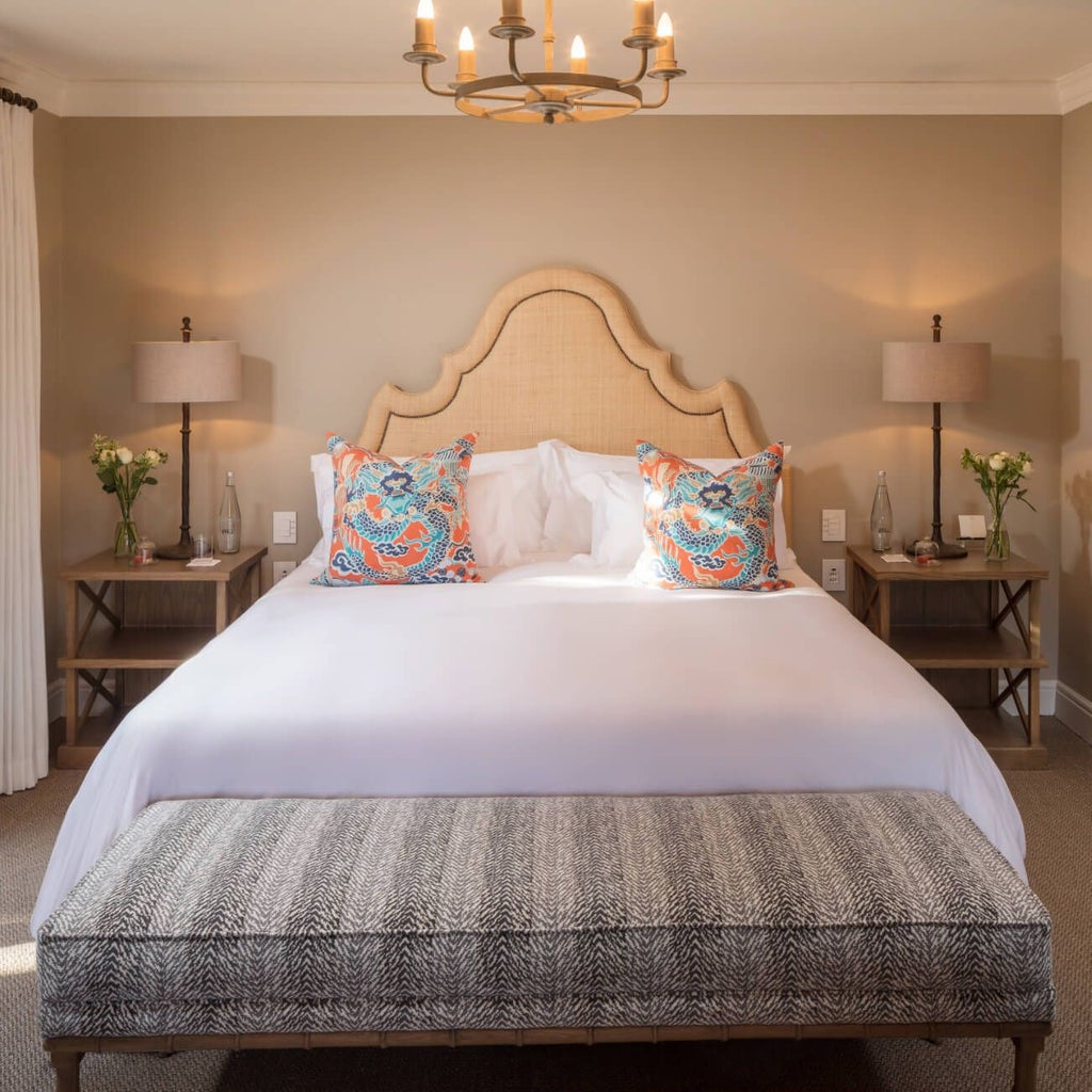 Luxurious pool suite at Le Quartier Français in South Africa, featuring elegant white-themed decor, private plunge pool, and modern minimalist design.