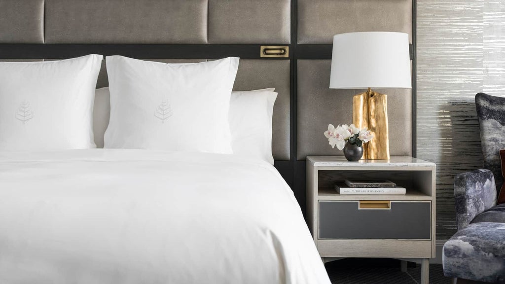 Luxurious Four Seasons hotel superior room with plush king bed, city view windows, modern neutral decor, and elegant minimalist design in San Francisco