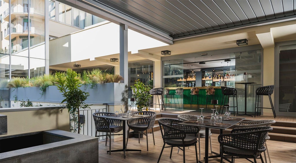 Modern, sleek hotel lobby in Florence with minimalist design, elegant marble surfaces, contemporary furniture, and soft ambient lighting creating a luxurious atmosphere.