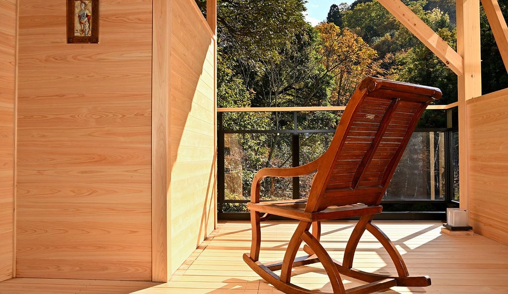 Minimalist traditional Japanese ryokan with elegant wood architecture, soft natural lighting, and serene garden view showcasing refined hospitality of rural Japanese landscape.