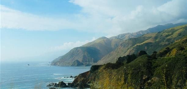 Luxurious Superior Hot Tub Suite with panoramic coastal views, elegant wooden interiors, and private outdoor hot tub overlooking scenic landscaping at Ventana Big Sur resort