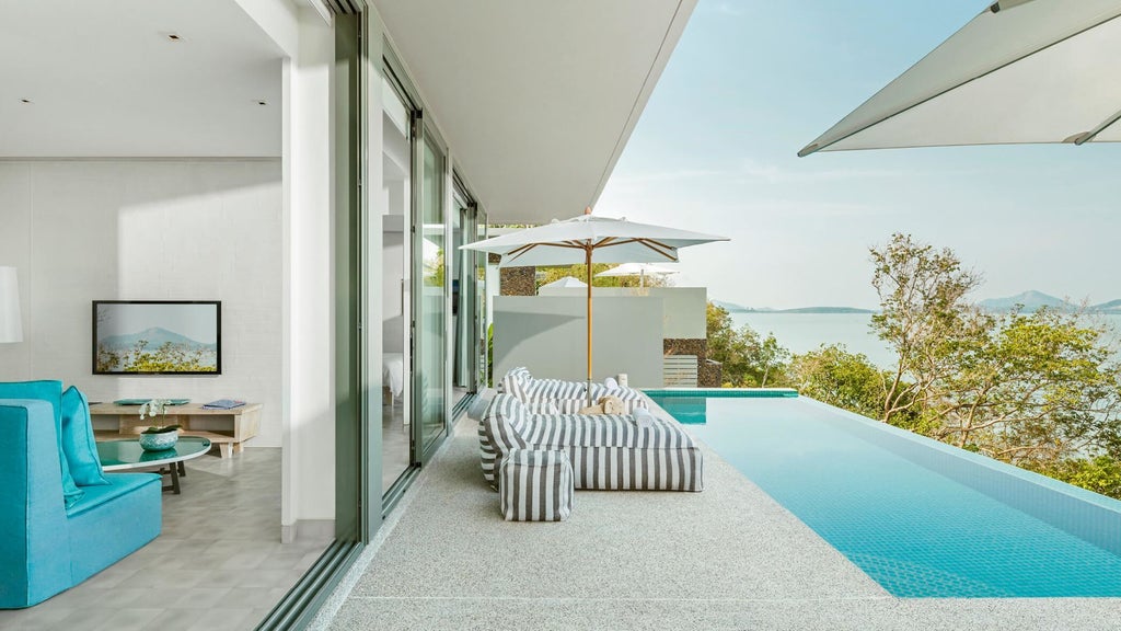 Luxurious one-bedroom pool villa with panoramic Phang Nga Bay views, featuring contemporary Thai design, sleek minimalist furnishings, and private infinity pool.